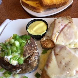 Double Malibu Chicken with bake potatoes with everything on it Double Malibu Chicken with bake potatoes with everything on it