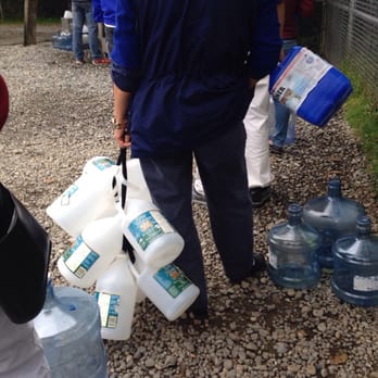 164th Street Artesian Well - All kinds of water jugs, big and small. This lady happens to bring used white vinegar bottles... - Landmarks & Historical Buildings Near Me - Lynnwood, Washington
