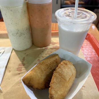 Miss Arepa - Plant based mushroom and cheese empenada and fish empenada with non plant based white and red sauce. Coconut slushie - Venezuelan Near Me - Lahaina, Hawaii Miss Arepa - Plant based mushroom and cheese empenada and fish empenada with non plant based white and red sauce. Coconut slushie - Venezuelan Near Me - Lahaina, Hawaii