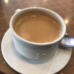 a cup of coffee on a saucer a cup of coffee on a saucer
