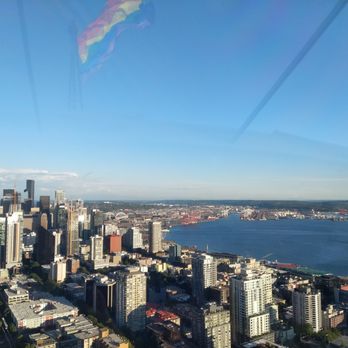 Space Needle - Photo from upper deck, reflection captured top of Space Needle and the Pride Flag - Landmarks & Historical Buildings Near Me - Seattle, Washington