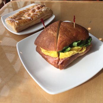 Ava Roasteria - Breakfast sandwich with ham, cheddar, spinach, tomato in ciabatta bread. Cheese turnover to finish. - Coffee & Tea Near Me - Hillsboro, Oregon Ava Roasteria - Breakfast sandwich with ham, cheddar, spinach, tomato in ciabatta bread. Cheese turnover to finish. - Coffee & Tea Near Me - Hillsboro, Oregon
