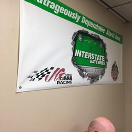 An advertisement sign hanging in the waiting area