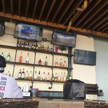 Tortuga's Kitchen & Bar - Outdoor bar and TV's - Bars Near Me - Flagler Beach, Florida