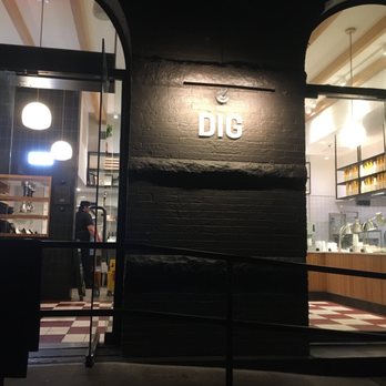 Dig Inn - the entrance to a restaurant at night - New American Near Me - New York, New York Dig Inn - the entrance to a restaurant at night - New American Near Me - New York, New York