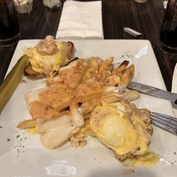 Shrimp and Lobster eggs Benedict. And drunken vodka fries Shrimp and Lobster eggs Benedict. And drunken vodka fries