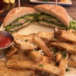 Pesto chicken sandwich and garlic fries Pesto chicken sandwich and garlic fries