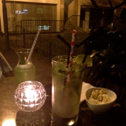 Cocotte - Drinks outside. There are four tables out front.