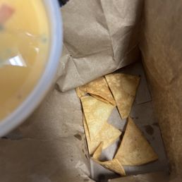The 7 chips given for a tub of queso The 7 chips given for a tub of queso
