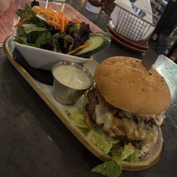 Next Door Gastropub - Ron Burgundy burger with a house salad served with blue cheese. - Gastropubs Near Me - Port Angeles, Washington Next Door Gastropub - Ron Burgundy burger with a house salad served with blue cheese. - Gastropubs Near Me - Port Angeles, Washington