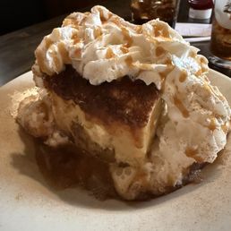 Warm Caramel Apple Bread Pudding with real whipped cream and a sprinkle of nutmeg!
