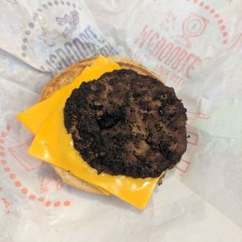 McDonald's - a hamburger with cheese and a black patty - Burgers Near Me - Carlisle, Pennsylvania McDonald's - a hamburger with cheese and a black patty - Burgers Near Me - Carlisle, Pennsylvania