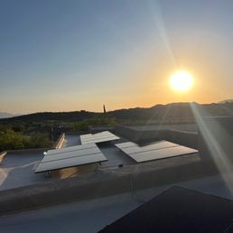 Roof panels with the sun setting