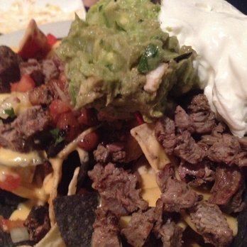 Rimrock Bar & Grille - Fresh guacamole, pico de gallo, sour cream with a fine cut of marinated steak. - Sports Bars Near Me - Phoenix, Arizona Rimrock Bar & Grille - Fresh guacamole, pico de gallo, sour cream with a fine cut of marinated steak. - Sports Bars Near Me - Phoenix, Arizona