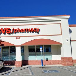 a car parked in front of a cvs pharmacy