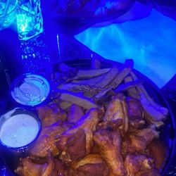 BTop Spot - Mild Wings and fries with ranch and Crab claws and fries in the distant