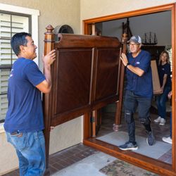 Caring Transitions workers moving furniture