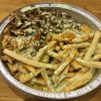 Kismet Cafe - Half chicken and half lamb over rice with fries and jalapeño sauce - Halal Near Me - Austin, Texas
