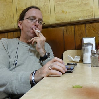 Beef House - In a Gandhi-like if futile attempt to shame Ples out of smoking, I, a non-smoker, take up the cig, because I can, in Beef House. - Diners Near Me - Garland, Texas