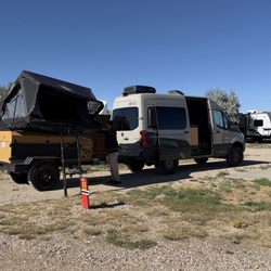 Rawlins KOA - Level pull through site with hookups and seating area.
