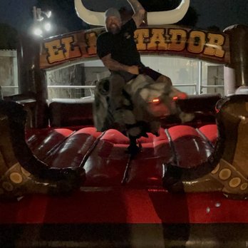 Tito's Toros Mechanical Bull Rental - My husband enjoying a bull ride after a few tequila shots for his 50th! - Party Equipment Rentals Near Me - Pacoima, California Tito's Toros Mechanical Bull Rental - My husband enjoying a bull ride after a few tequila shots for his 50th! - Party Equipment Rentals Near Me - Pacoima, California