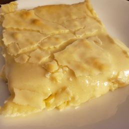 Gooey butter cake oozed all over the plate Gooey butter cake oozed all over the plate