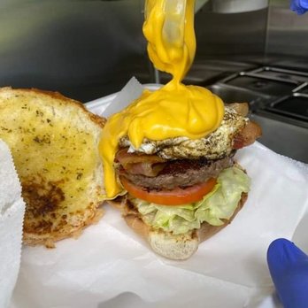Phat Guy Burgers - Morning burger topped with bacon fried egg and cheese sauce - Food Trucks Near Me Phat Guy Burgers - Morning burger topped with bacon fried egg and cheese sauce - Food Trucks Near Me