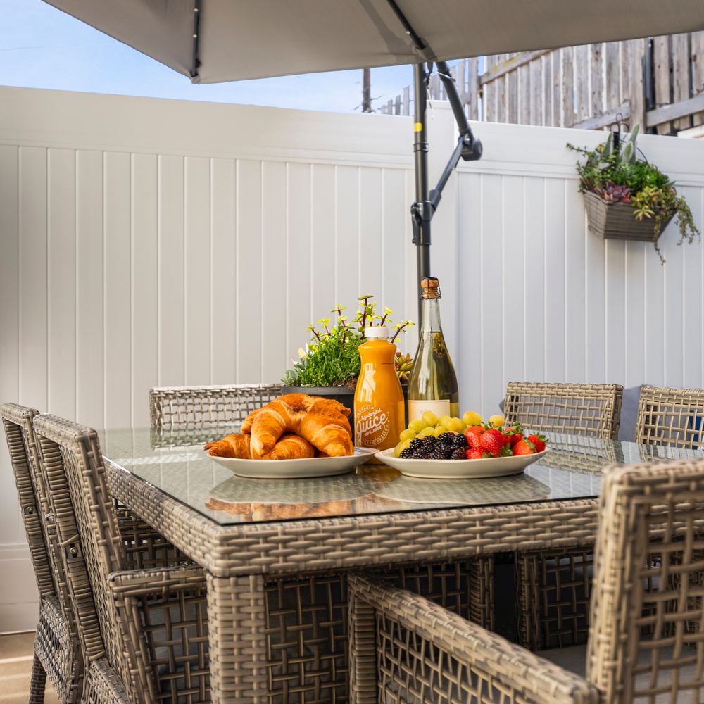 Mumford Designs - vacation home patio staging, designed furniture and fencing - Interior Design Near Me