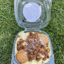 a plastic container with a dessert in it a plastic container with a dessert in it