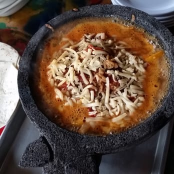 Vinyl Taco - The molcajete is the volcanic rock-like bowl in which the fajita-esque stew is served bubbling hot. - Tapas/Small Plates Near Me - Fargo, North Dakota Vinyl Taco - The molcajete is the volcanic rock-like bowl in which the fajita-esque stew is served bubbling hot. - Tapas/Small Plates Near Me - Fargo, North Dakota