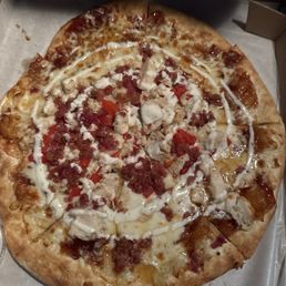 Trash pizza with toppings piled in the middle Trash pizza with toppings piled in the middle