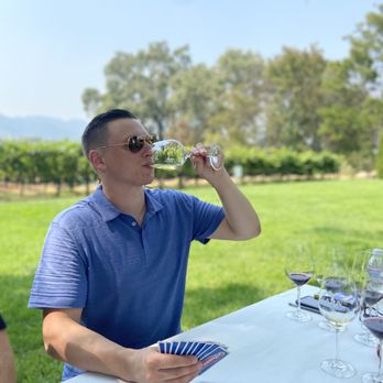Napa Cellars - Played cards outside while drinking wine under the trees by the vineyard - Wineries Near Me - Oakville, California Napa Cellars - Played cards outside while drinking wine under the trees by the vineyard - Wineries Near Me - Oakville, California