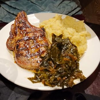 Mystic Grill - Pork Chop Honey Dijon glazed with mashed potatoes and bacon braised greens - Southern Near Me - Covington, Georgia