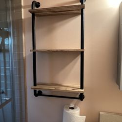 EZ Baths - Rack installation over the toilet bowl.  They hung this up for us.