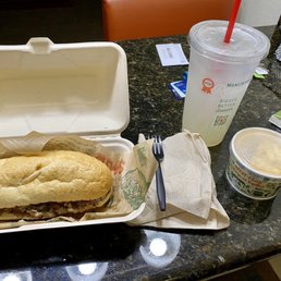 Steak and mushroom sandwich and Mac and cheese with lemonade. Complete with TWO napkins and a loose fork.