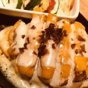 Applebee's Grill + Bar - Sizzlin' Cheddar & Bacon Chicken Skillet with an upgraded roasted vegetables - American Near Me - Azusa, California Applebee's Grill + Bar - Sizzlin' Cheddar & Bacon Chicken Skillet with an upgraded roasted vegetables - American Near Me - Azusa, California