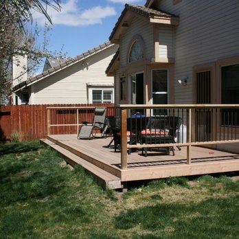 UB Fixed - a patio with a table and chairs - Handyman Near Me UB Fixed - a patio with a table and chairs - Handyman Near Me