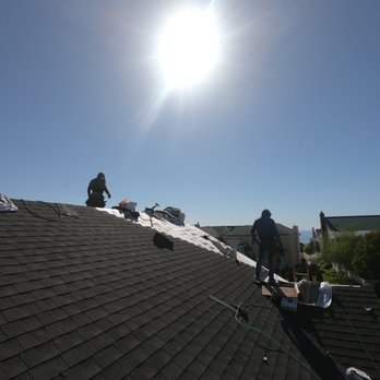 Sharp Roofing - wo men working on a roof - Roofing Near Me - Holland, Michigan Sharp Roofing - wo men working on a roof - Roofing Near Me - Holland, Michigan