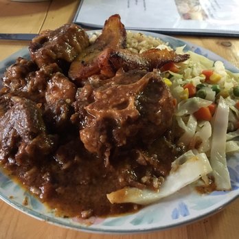 Norah's Irie - Ok tail stew with cabbage and rice with peas just delicious!!!! - Caribbean Near Me - Long Branch, New Jersey