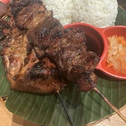 Chicken inasal and pork skewer combo with toyomansi and atchera. Chicken inasal and pork skewer combo with toyomansi and atchera.