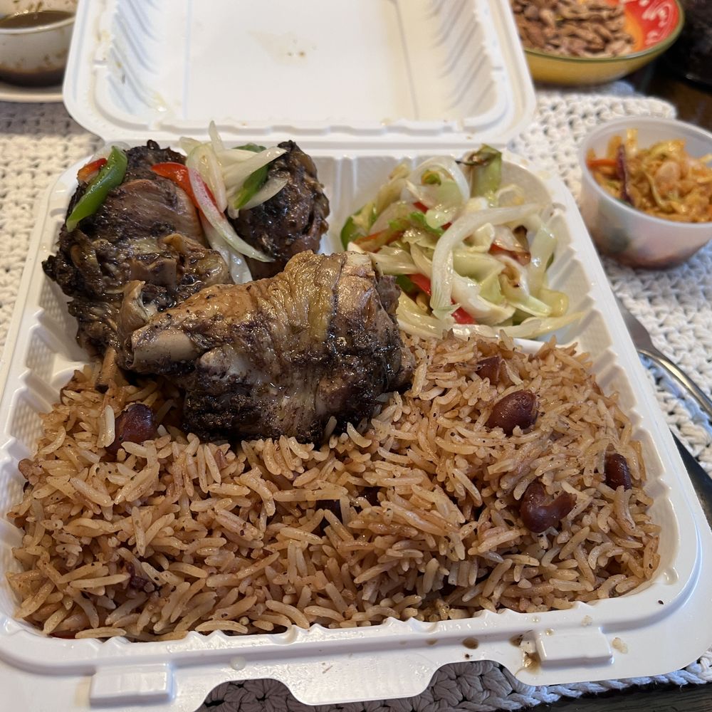 Kiwaz - Jerk chicken with rice/beans and sauteed cabbage, spicy slaw on the side. This was a medium! - Caribbean Near Me - Waltham, Massachusetts