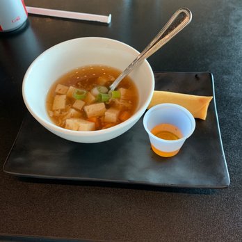 A Bite of Lao and Thai - Hot and sour soup with egg roll come with lunch. - Thai Near Me - Allen, Texas