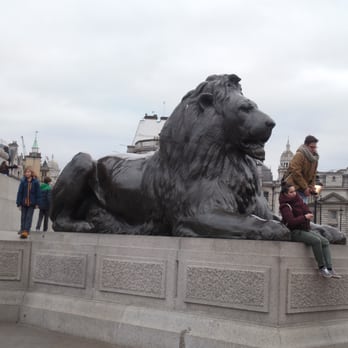 Trafalgar Square - Stately lion at base of Nelson's Column - Landmarks & Historical Buildings Near Me - London, XGL