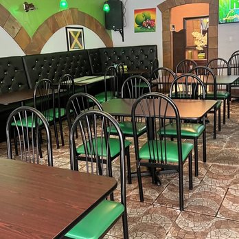 TFK - Trelawny Fusion Kitchen - tables and chairs in a restaurant - Caribbean Near Me - Stockbridge, Georgia