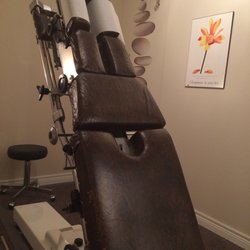 Balance Family Chiropractic - The adjustment bed. You stand up against it and the chiropractor slowly winds you down yo lying position.
