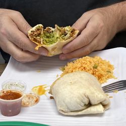 Tijuana Tacos - Marinated pork burrito with rice.