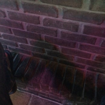 Legends Pub & Grill - a brick wall with a hole in it - Sports Bars Near Me - Avon, Indiana