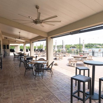 The 1918 - a patio area with tables and chairs - Venues & Event Spaces Near Me - Tampa, Florida