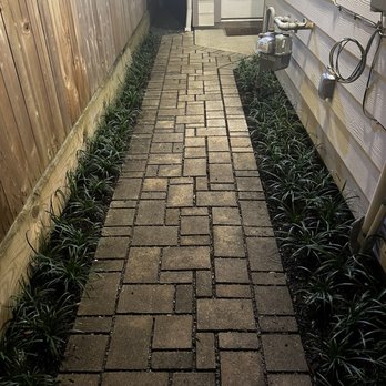 Candlewood Landscaping Services - Walkway to front door. Blue liriope - Landscaping Near Me