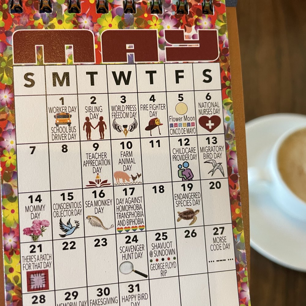 Eastlake Coffee + Cafe - a calendar on a table - Coffee & Tea Near Me - Seattle, Washington